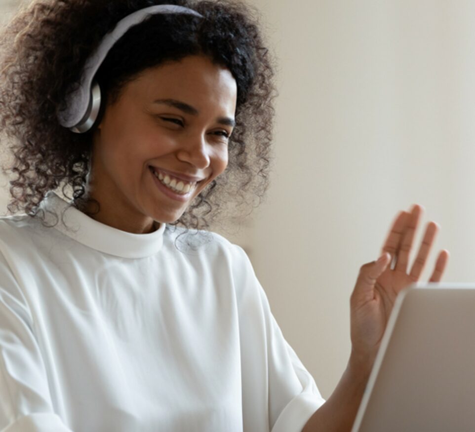 Image of interpreter looking at computer for Learn Q blog on interpreting FAQs