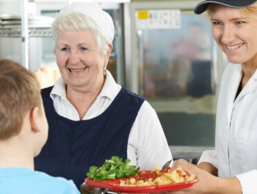 image of school dinner being served for Learn Q Understanding Food Safety in Primary Schools article