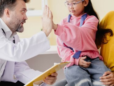 Image of doctor and child for Learn Q Understanding the NHS Policy on Interpreting blog