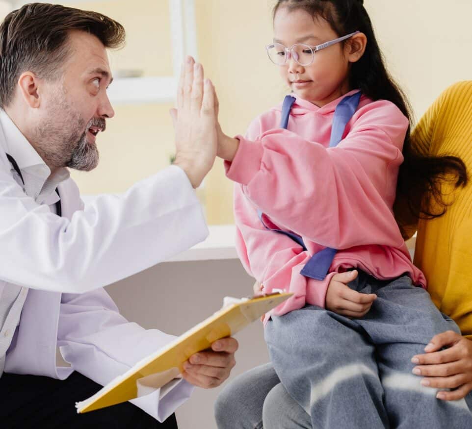 Image of doctor and child for Learn Q Understanding the NHS Policy on Interpreting blog