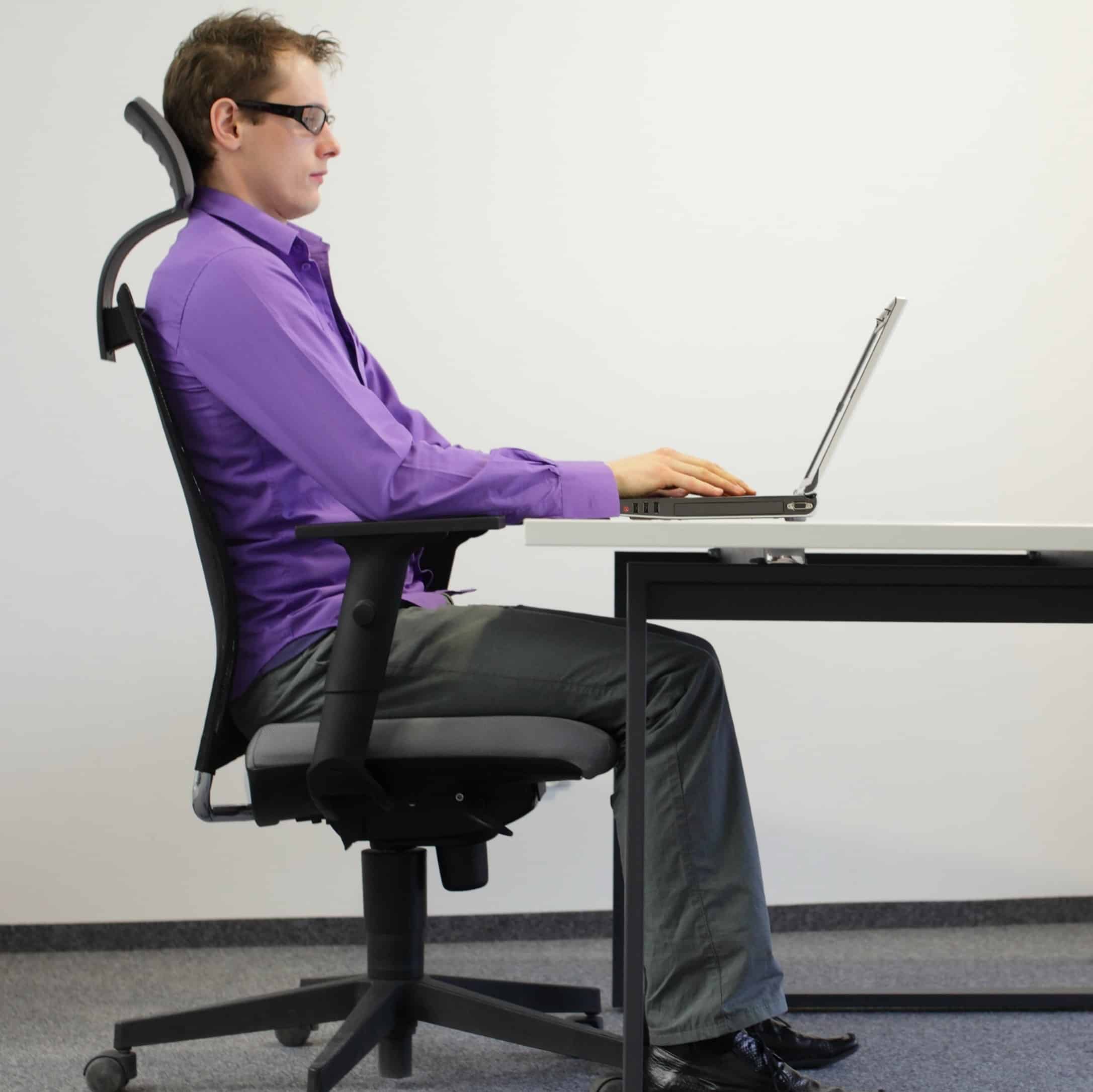 Image of man in office sat correctly for Learn Q Debunking Common UK Health and Safety Myths blog