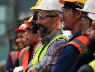 image of workers in PPE for Learn Q Health and Safety Protecting Your Staff blog