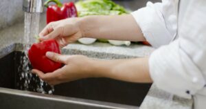 Image of chef washing food for Learn Q How Important is Food Safety in Business blog