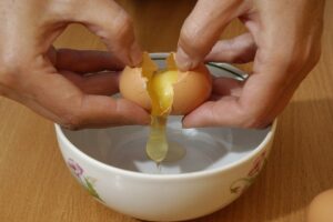 Image of cracked egg for Learn Q Debunking Common UK Food Safety Myths blog