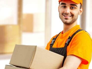 Image of man carrying boxes for Learn Q Safer Workplace Legislation Covering Manual Handling