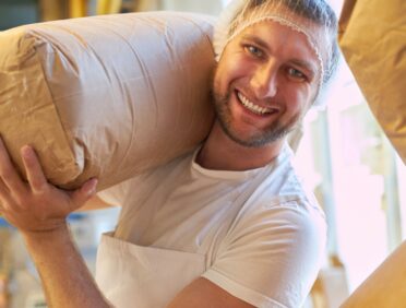 Image of man in food factory for Learn Q Understanding Food Safety in the Manufacturing Industry blog