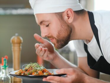 Image of Chef Serving up a Dish for Learn Q Understanding Food Safety for Food Business Owners blog