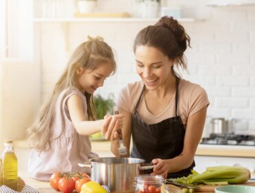 Image of Mother and Daughter Cooking for Learn Q The Hidden Dangers of Fresh Vegetables blog