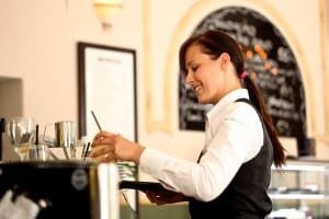 Image of Waitress Serving Beverage for Learn Q Understanding Food Safety for Catering Managers blog