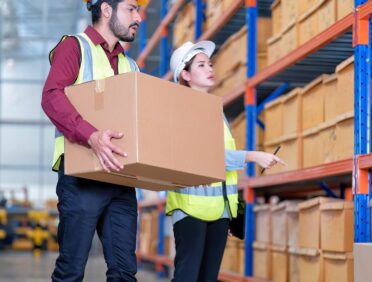 Image of worker lifting a crate in a warehouse for Learn Q The Level 6 Diploma in Public Service Interpreting (DPSI) Course blog