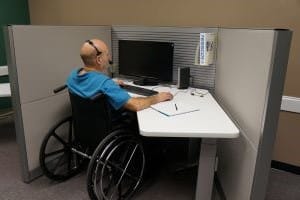 Image of Male Worker in Wheelchair for Learn Q Health and Safety Disabled People at Work blog