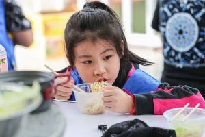 Image of Girl Eating School Meal for Learn Q Level 2 Food Hygiene and Safety for Schools blog