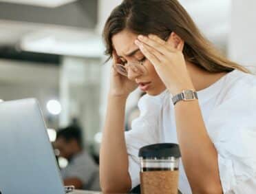 Image of Woman not Feeling Well at Work for Learn Q Health and Safety Sickness and Absence at Work blog