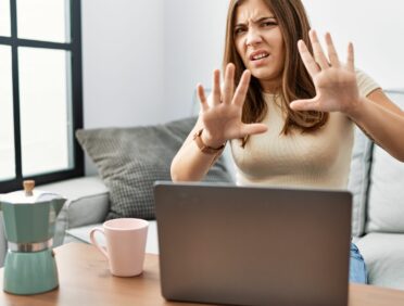 Image of Young Woman Stopping Aggression at Work for Learn Q Health and Safety Violence and Aggression at Work blog