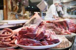 Image of raw meat in a restaurant for Learn Q The Hidden Dangers of Meats blog