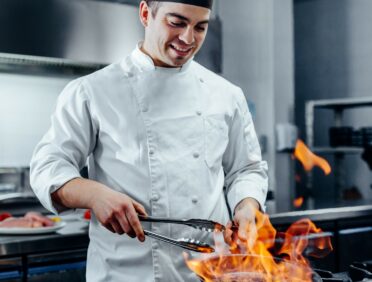 Image of a chef cooking for Learn Q The Hidden Dangers of Cooking Surfaces blog