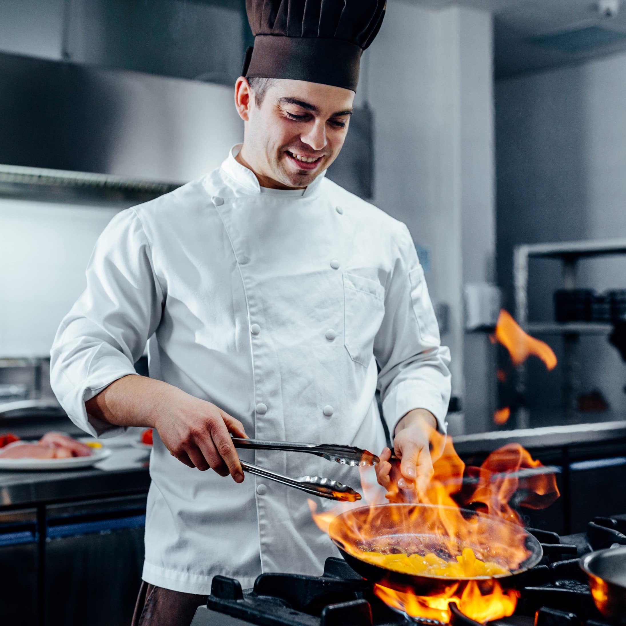 Image of a chef cooking for Learn Q The Hidden Dangers of Cooking Surfaces blog