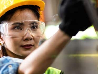 Image of lady working a machine for Learn Q Health and Safety Work Equipment and Machinery blog