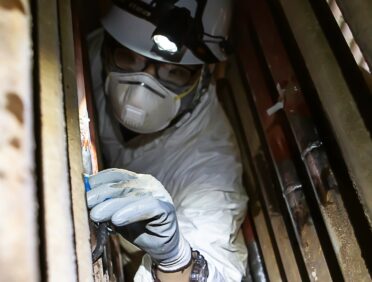 Image of someone working in a tight space for Learn Q Working in Confined Spaces blog